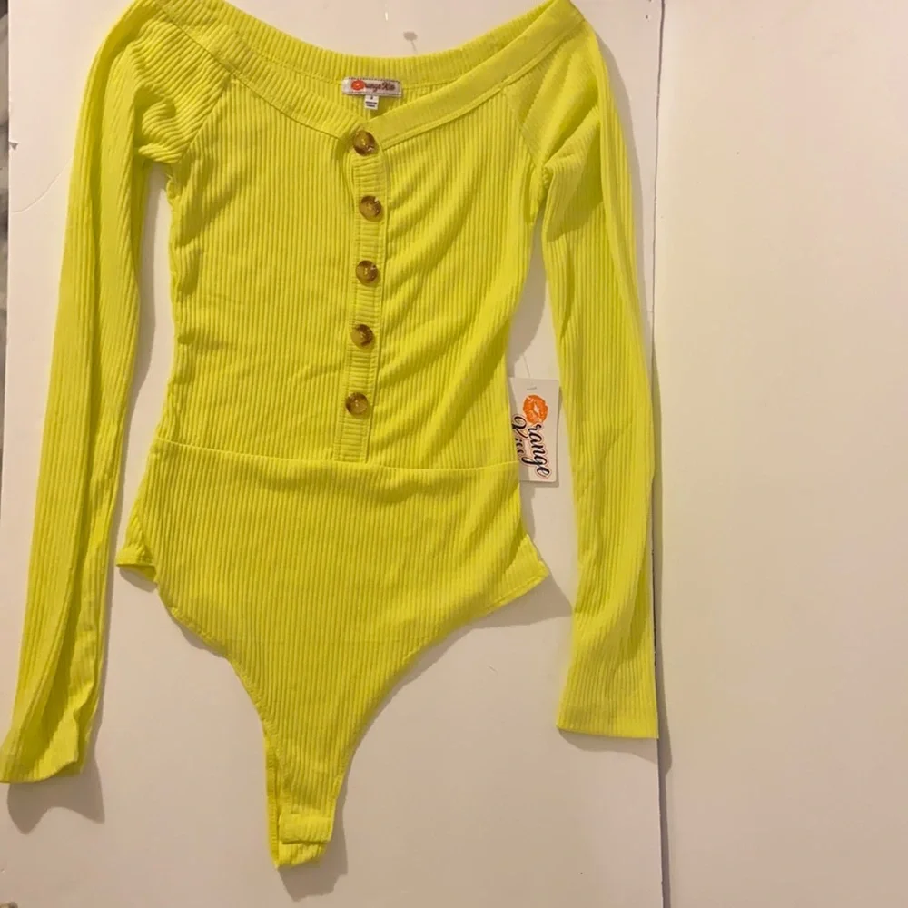 Neon yellow long sleeve sexy body suit. Size small. New with tags